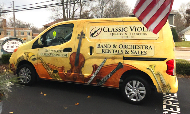 Classic Violins driver's side door with graphic installed.